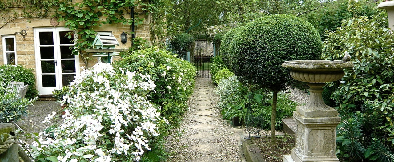 This is a classic Cotswold garden 10 years on that I designed for my clients who love it still