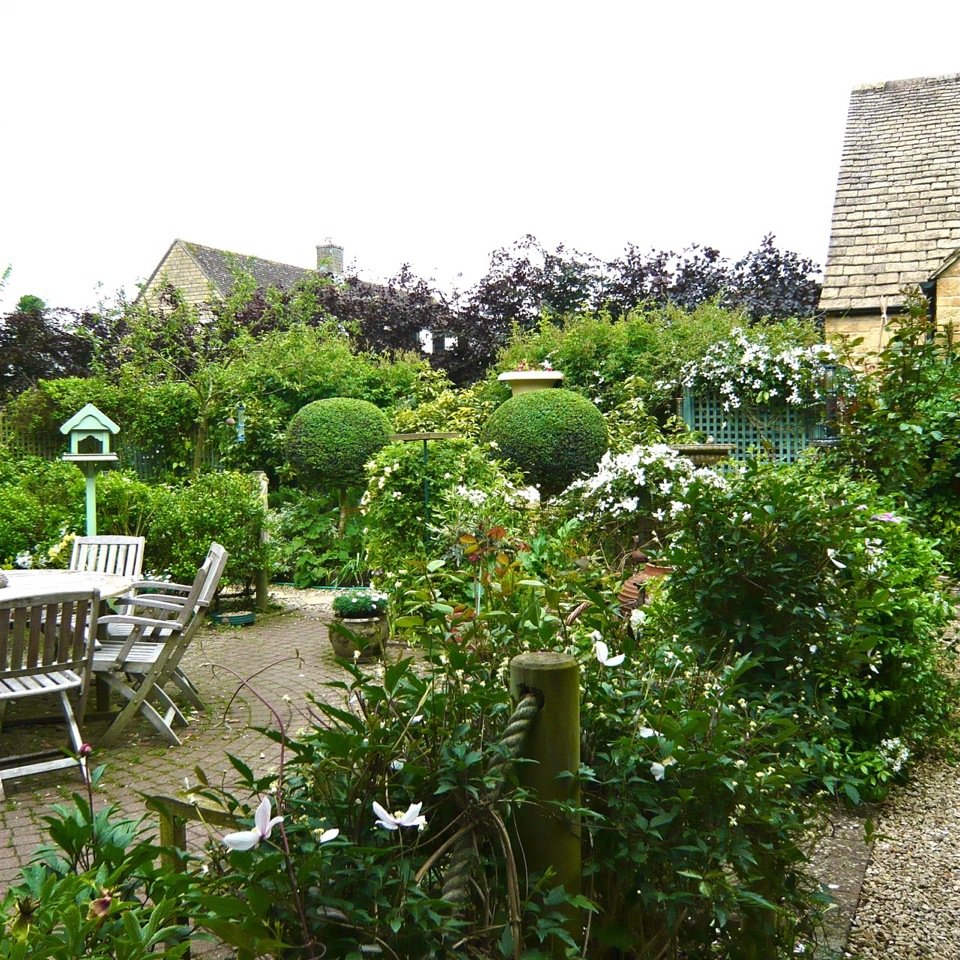 This is the 'dining room' within this traditional Cotswold garden I designed 10 years ago.