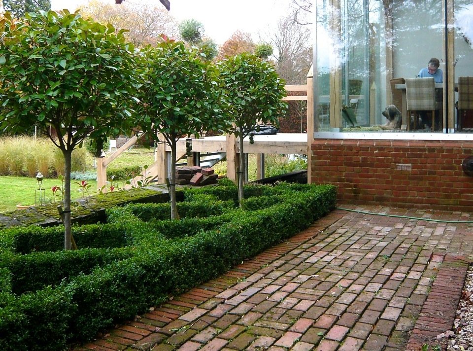 This is our own little courtyard beside our glass box extension. Since this was taken we have replaced the brick for large stone flags for a more contemporary look.