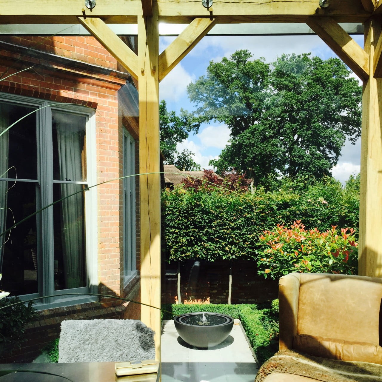 This is the view from inside our oak framed dining room looking out to our formal courtyard garden