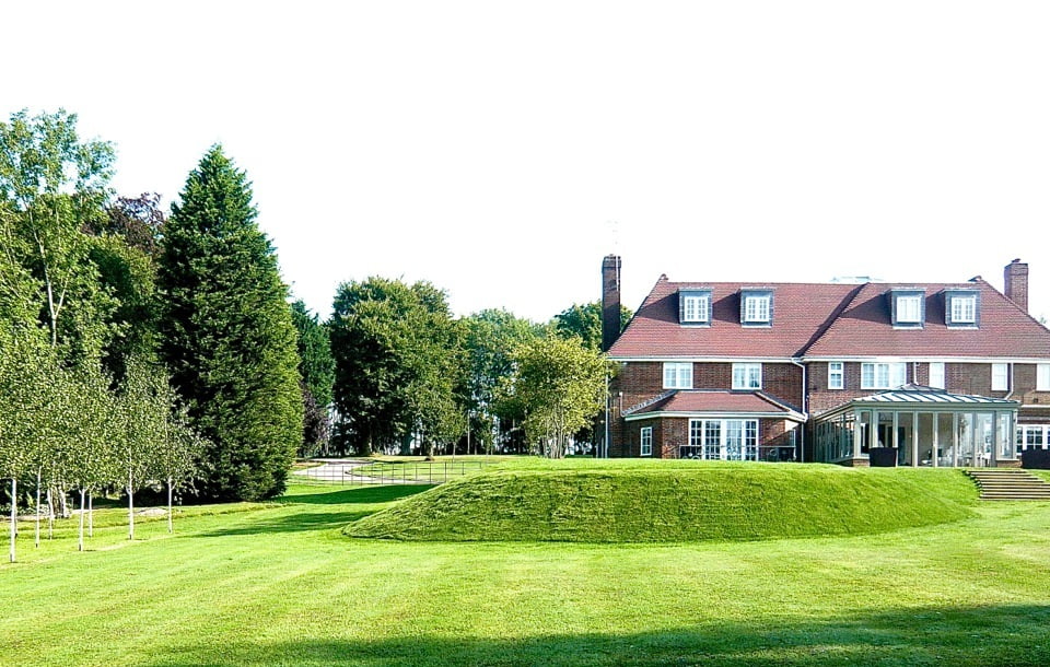 This photo shows how we raised the lawn to meet the house. My client isn't mad keen on hard landscaping & wanted to feel the grass beneath her feet in the summer. By using land sculpture we sit the house far more successfully into the garden & the children love to run up & down it.