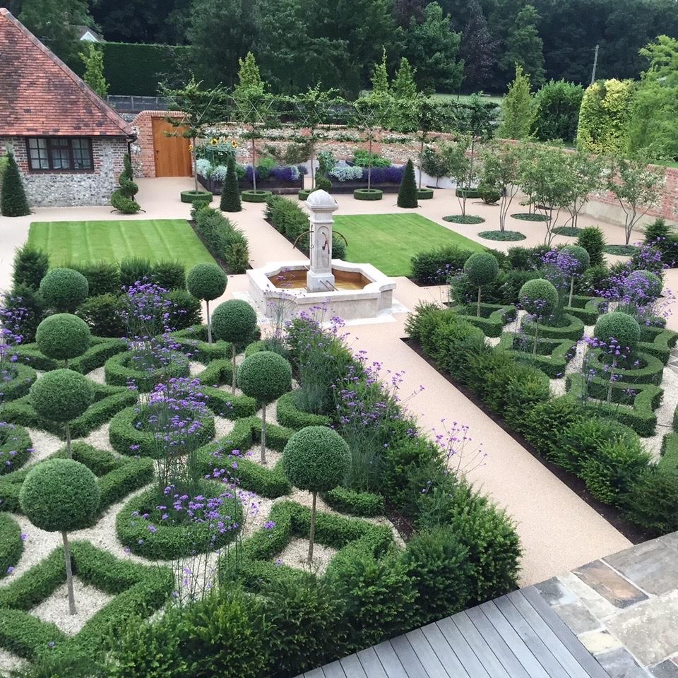 This is a contemporary french style formal garden for a walled garden near henley on thames