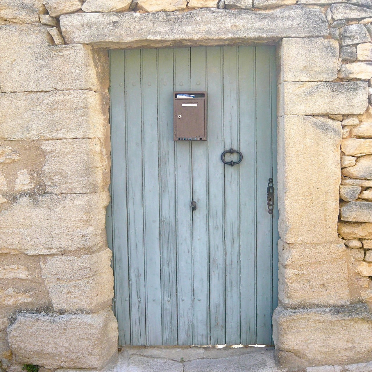 This blue door looks wonderful against the raging stone. I took this photo in Provence & just loved these simple understated entrances