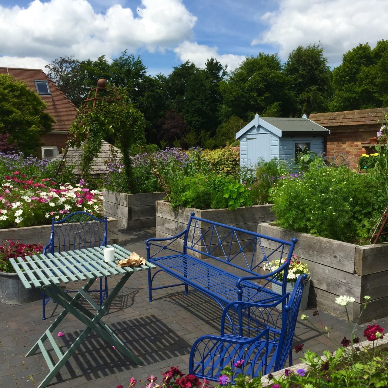 This cutting garden was one of the first things I designed for my client Jane. I had once been a swimming pool that had been filled in before she bought it. Due to all the rubble below the surface we built these raised beds which work really well. It's a great sunny spot & the plants absolutely thrive. It's such a lovely place to hang out too.