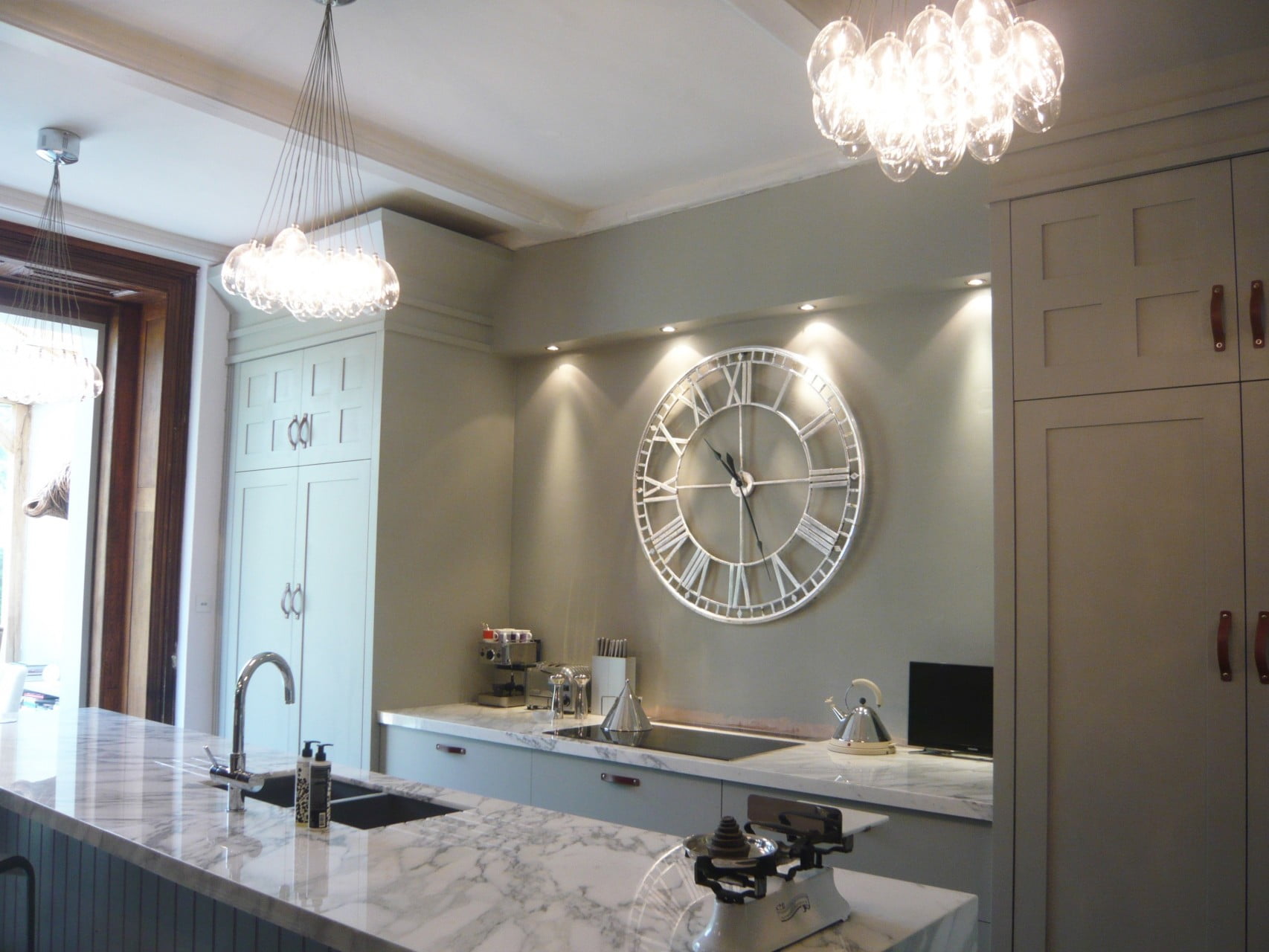 I redesigned our kitchen to make the most of the tall ceilings & to reflect the Victorian house we live in. It's contemporary - not pastiche