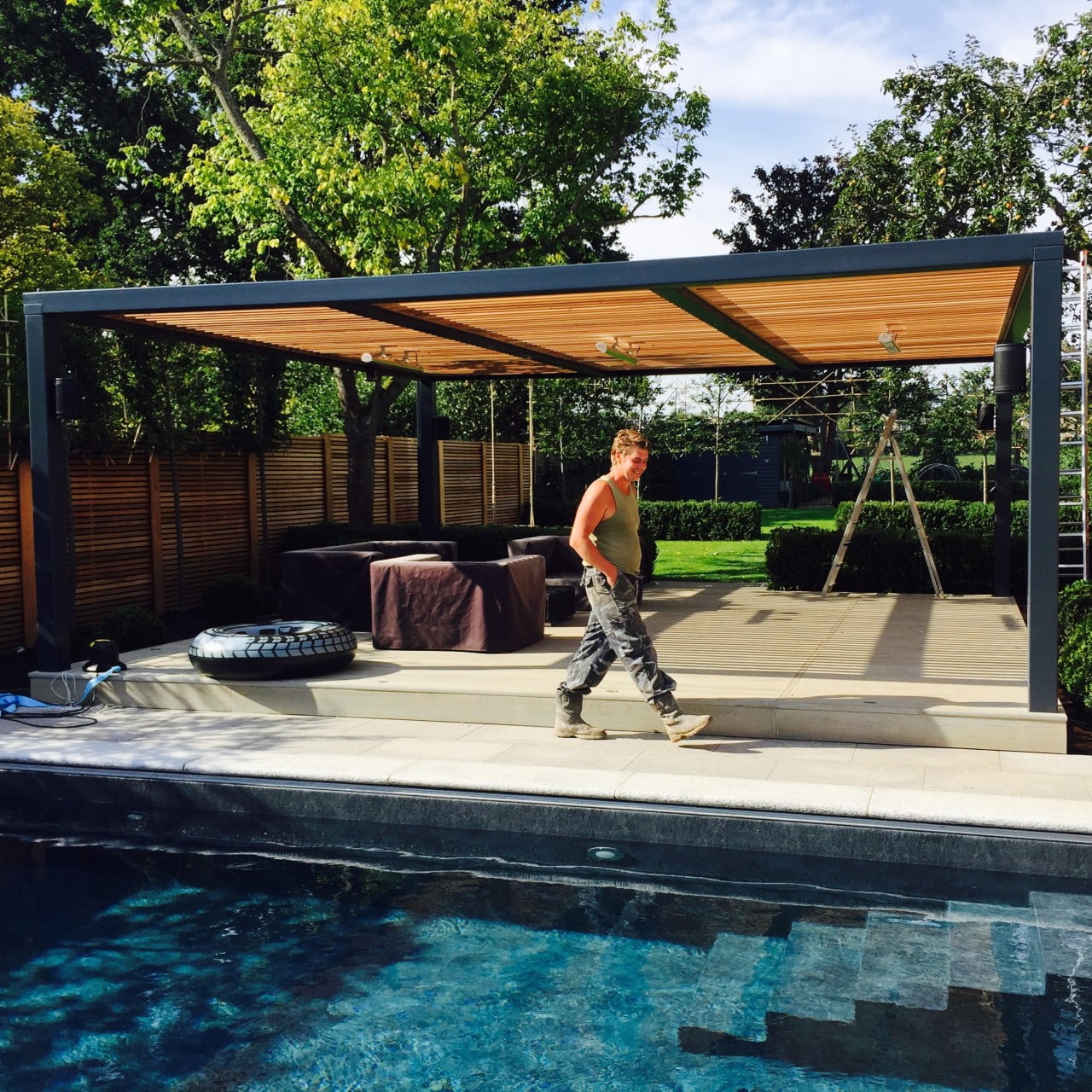 This is one of the team who built this contemporary garden with swimming pool I designed in Berkshire