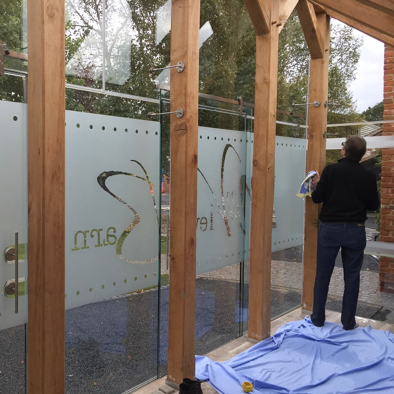 Here we are installing the etched glass name for my clients porch