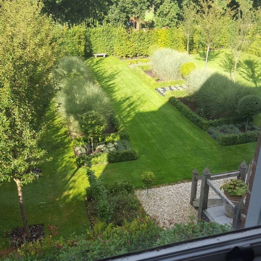 This is my own formal large garden here in Newbury Berkshire. We have lines of cherry trees & formal beds with ornamental grasses & topiary