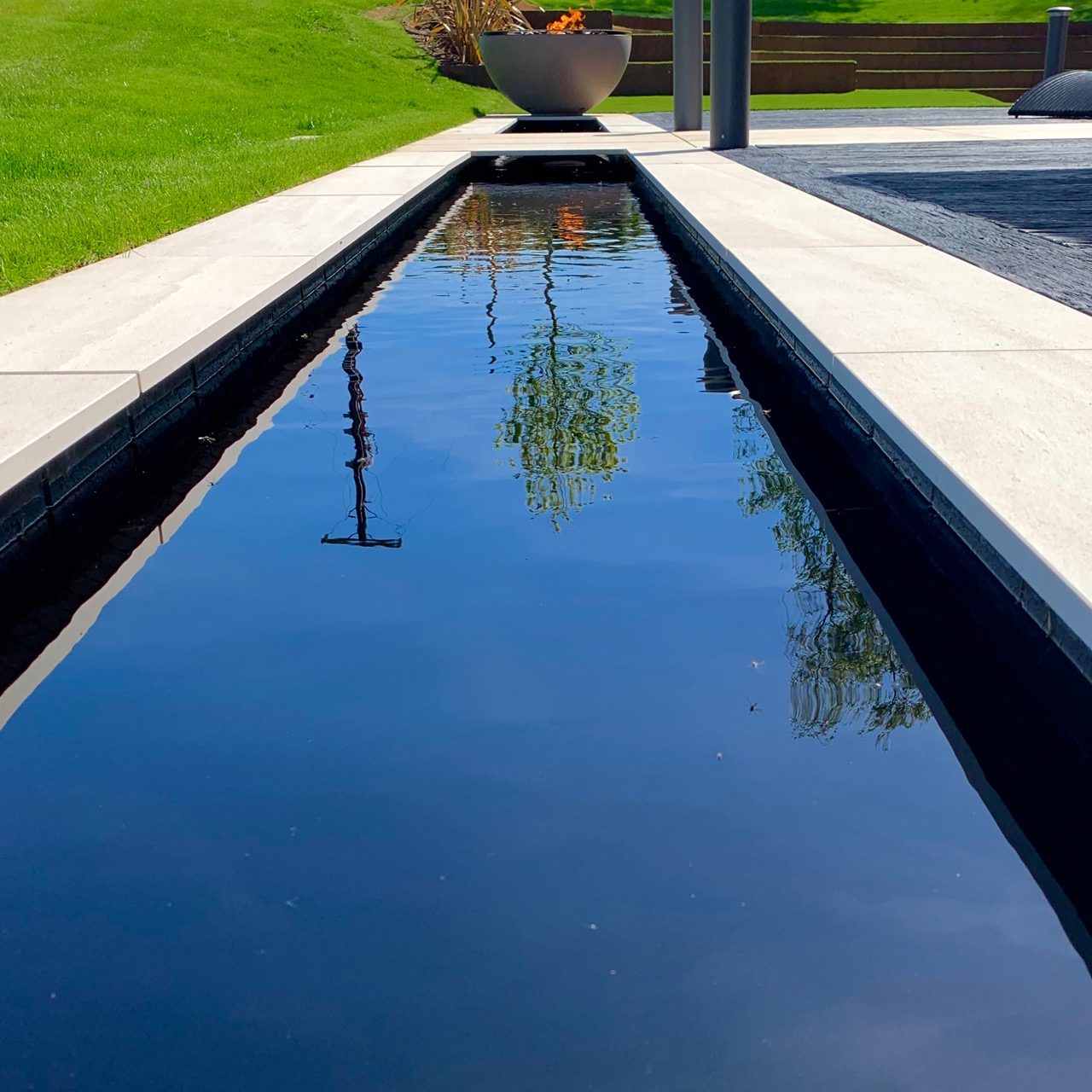 Great reflection pool in a contemporary Cotswold garden by Jo Alderson Design