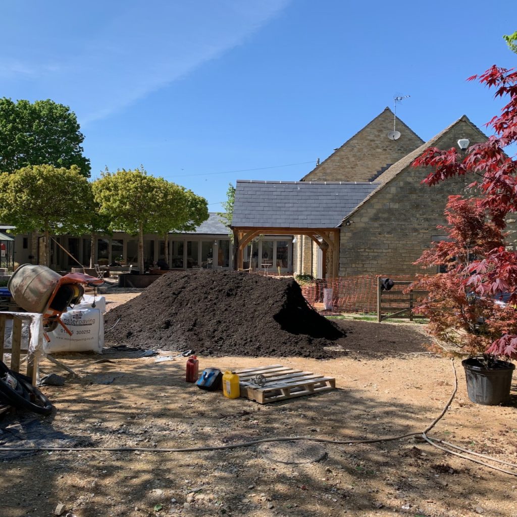 A massive heap of compost delivered by our friendly local farmer for our new garden